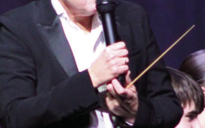 Gae Phillips, director of bands led the Columbus High School band during the Christmas Concert held December 19