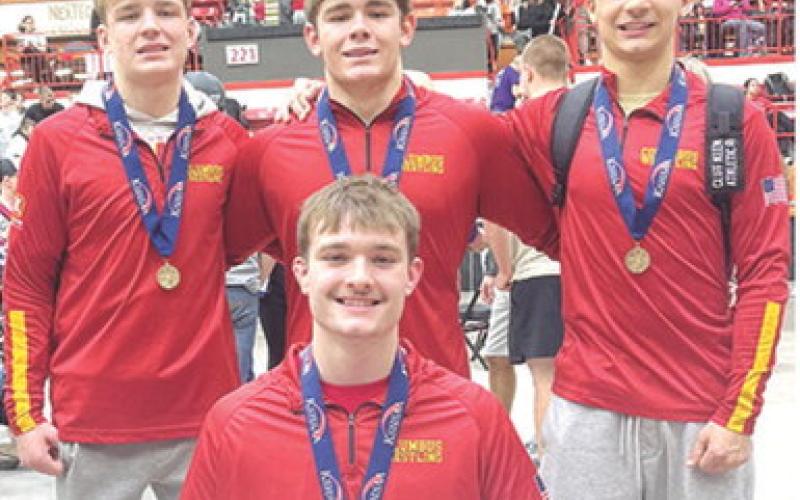 Four Titans placed in the top six at the Kansas Boys Class 4A State Wrestling Championship Tournament to help the Columbus Team to a sixth place team finish. Junior, Mason O’Banion, (front) is the first state champion for the Titans in 11 seasons. Sophomore, Chase Pelt placed sixth, sophomore, Kash Smith was second, and senior, Jayden Rodriguez finished in fifth place at the season finale. Photo by Nate Jones.