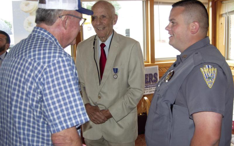 Candidates Jack Garner, Paul Rogers and Nate Jones visit during the Baxter Springs Chamber of Commerce Forum Tuesday morning. Fifteen candidates for local and state offices attended as well as several interested voters. Each had a chance to visit with the candidates.
