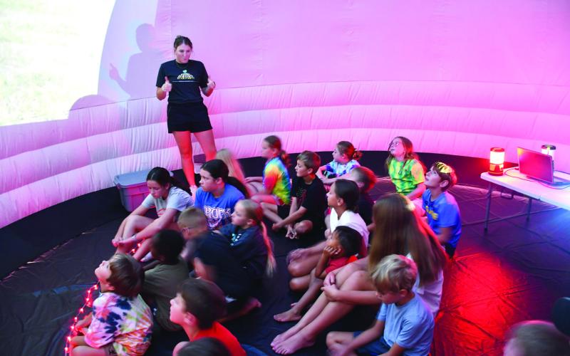 Greenbush and the Columbus Library partnered on July 23 to bring a planetarium experience to the children of Columbus. Kenzie Underwood talks to students about the many fascinations of the cosmos.