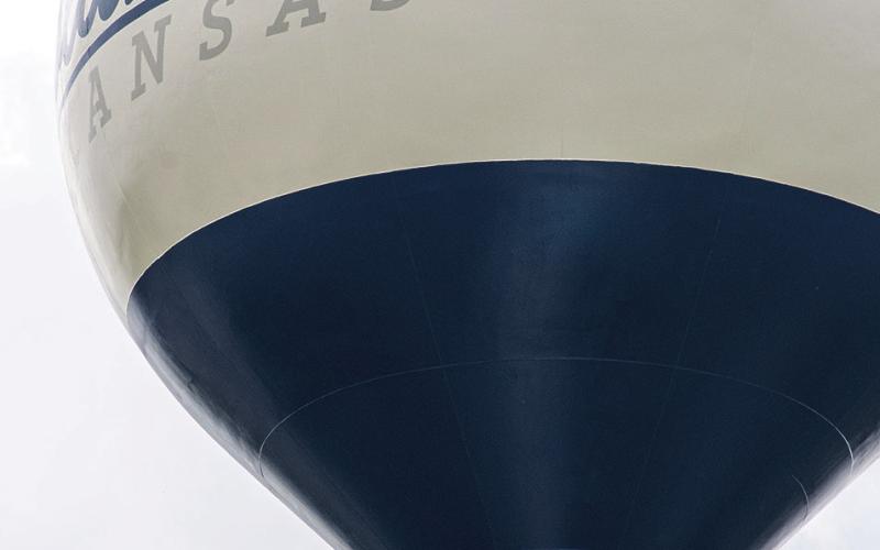 Workmen were finishing the work on the water tower in Columbus City Park. The iconic ships have been replaced with the city’s official logo. The decision for the change was made at the April 6 Columbus City Council meeting.
