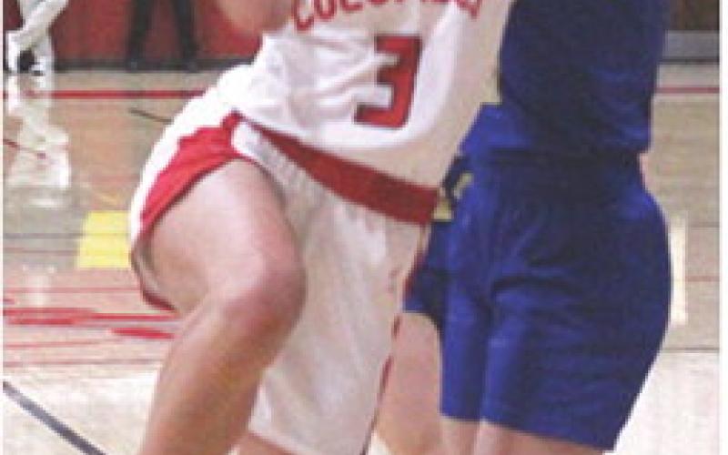 Lady Titan Senior, Brylie Johnson, goes up against a towering defense in the 17-40 loss to Riverton, Tuesday, at the CUHS Gymnasium. Brylie led the Lady Titans in scoring with eight. The Lady Titans will play in Pittsburg at St. Mary’s-Colgan tonight at 6 p.m.