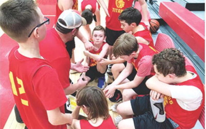 The Columbus Rec Commission Fourth Grade Boys Team makes a plan during a time out at Baxter Springs, Saturday. Team members are Wyatt Patton, Bryson Delmont, Jaxsyn Robinson, Lee Snow, Phoenix Rider, Gus Garrison, Westin Patton, and Kamden Sallee. Courtesy photo.