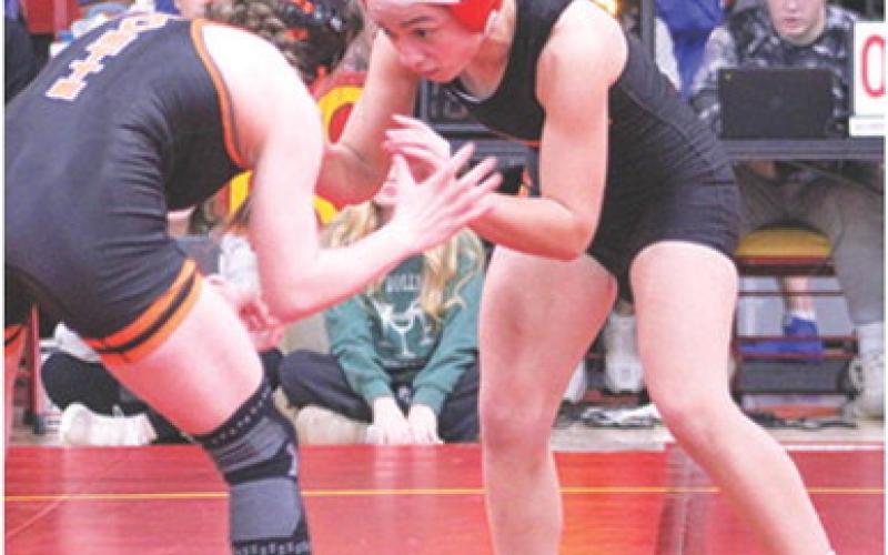 Lady Titan Hannah Noel, takes on an opponent during the recent Columbus Duals Tournament at the CUHS Gym. Hannah opened the season with a third place finish at the Kan-Okla Tourney and a win in the Bentonville West Tourney.