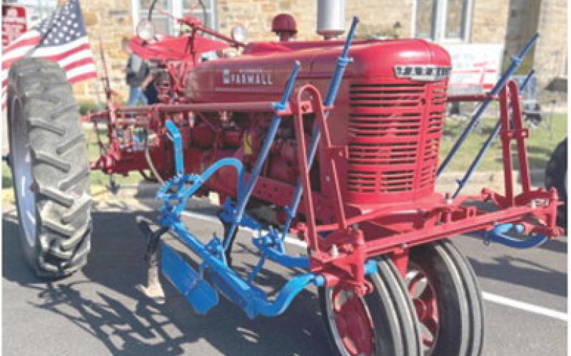 The Farm Heritage Show was held during the Columbus Day Festival. The above tractor, a 1951 Farmall H was entered into the show by Jim Zook. He was awarded “Best in Show”. Zook is pictured below right.