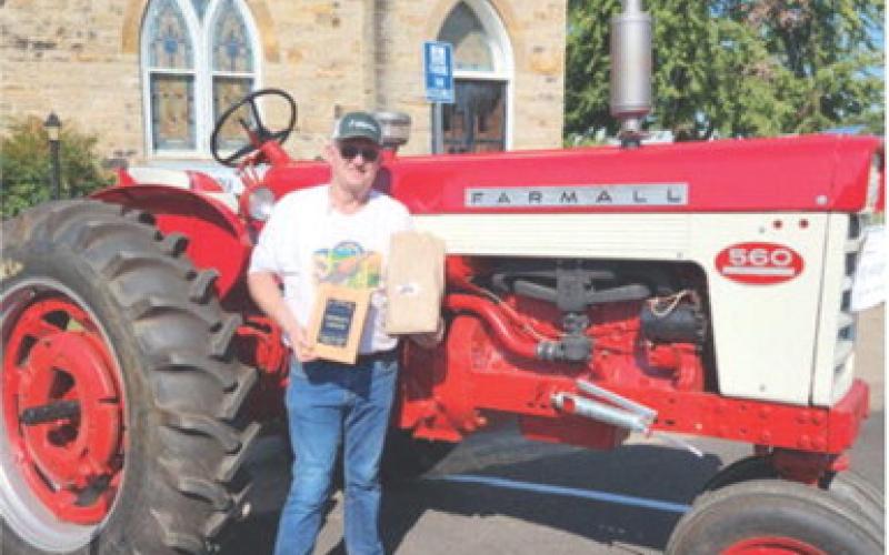 The Farm Heritage Show was held along Pine Street during the Columbus Day Festival. Farm equipment of all ages and types were on display. Bob Duffin won the “People’s Choice” award. He entered his 1958 Farmall 560.