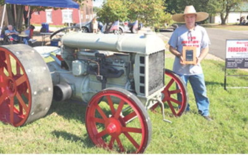 Exhibitors came from near and far to be a part of the Farm Heritage Show held during the Columbus Day Festival. Mark Barrett brought his 1919 Fordson to Columbus from Andover. Barret was presented the award for “Oldest” entry. Many of the owners drove their tractors in the parade earlier in the day. Photos on this page courtesy of the Karsten family.