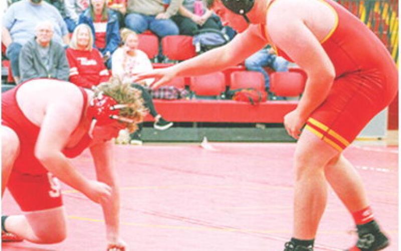 Columbus Titan Wrestler, Cajen Smith, took wins in two matches, Tuesday, in home multi-state duels at the Columbus Unified High School. The Titans split matches, 21-20, in the three-school event.