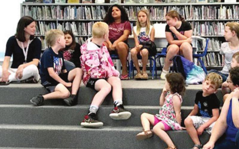 Those attending the Johnston Public Library Tails and Tales program