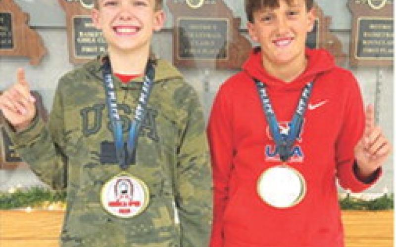 Lucas Natalini, 12U, 95B, and Briggs Johnson, 12U, 100B, took first place in their respective age/weight classes at the Seneca, Mo. Youth Open Tournament, December 7. Lucas got two quick falls before winning a 5-3 decision in the championship match. Briggs won his first match by fall then earned technical falls in the semi-final and championship matches. Courtesy photo.