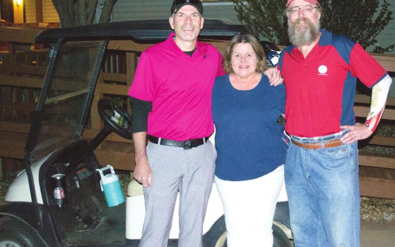 Two Arkansas men played 18 holes of golf on four courses in four states on Tuesday. Ty Stephenson, Bella Vista and Shane Working of Cave Springs started the trip in Baxter Springs on Tuesday. The two men posed with Golf Club hostess Jackie Gaffingaux before the first tee.