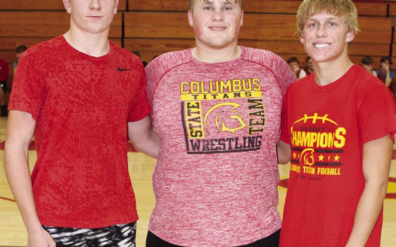 Senior members of the Titan Wrestling Team were introduced during the Meet the Titans Night at the Columbus Unified High School Gymnasium, November 28. Kayden Cox, Jake Eddington, and Cade Saporito.