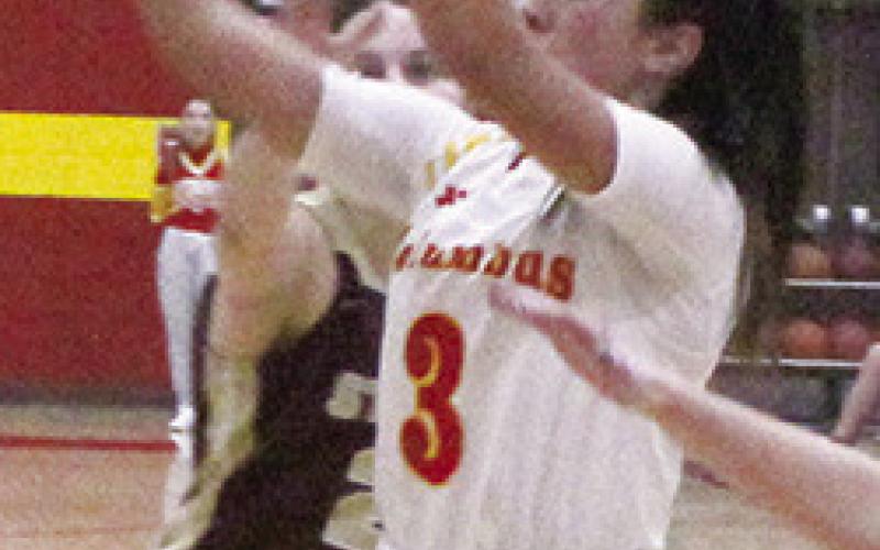 Sophomore, Brylie Johnson, shoots for two of her seven points in the Lady Titans 45-42 win over St. Paul, Tuesday, at the Columbus High School Gym.