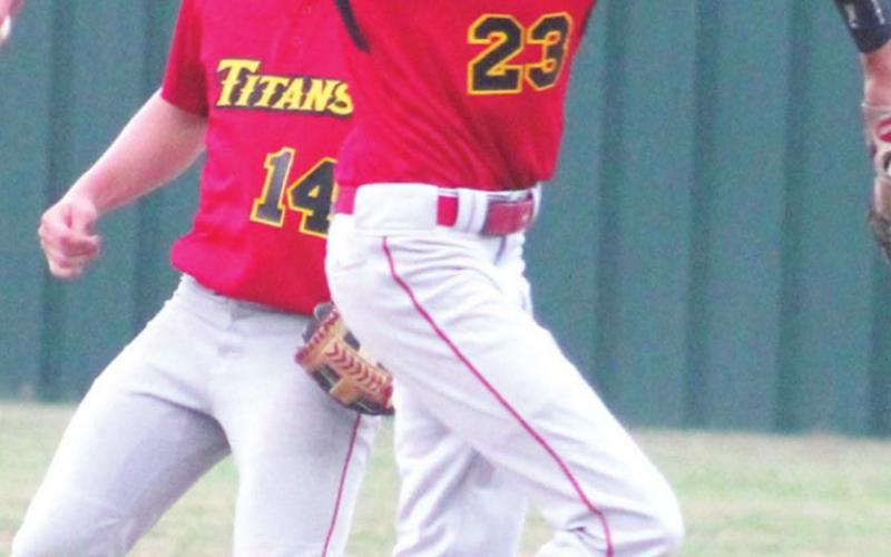 Kolt Ungeheuer, Titan Senior, steps on second and throws to first for a pair of outs on the double play in the, 7-3, Columbus win over the Lions in Baxter Springs, Monday. The play was the third double play of the game with Kolt being the middle man on a 4-6-5, two-out play in the third inning and an unassisted double play in the first inning when he caught a line-drive and doubled up the runner off the bag at second.