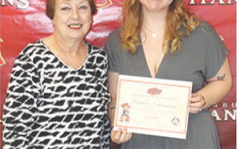 Natalie Edmondson received the Oklahoma State University Out-of-State Achievement Scholarship in the amount of $7,000 during the Senior Assembly at Columbus Unified High School Gymnasium, May 15. The award was presented by Karen Langerot, USD 493 Instructor.