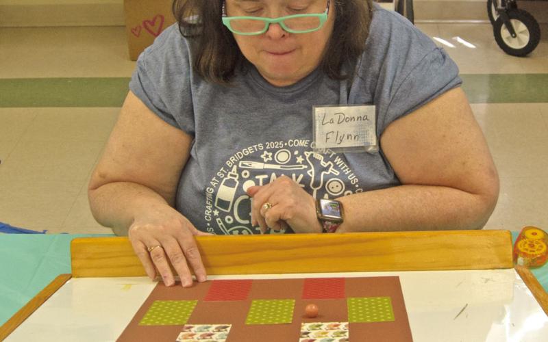 LaDonna Flynn works on her Barn Quilt project during the craft day.