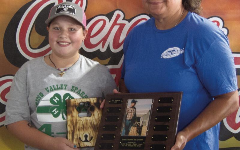 Mia Andrews was presented the award for Beginning Overall in the dogs division. The award, in memory of Buck Sharp, was was presented by Anne Sharp during the awards ceremony Saturday night of fair week.
