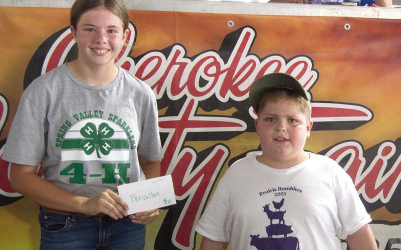 Kate Martin was named Grand Champion in Floriculture. She received her award Saturday night of Fair week. The award was presented by Fair King Titus Woods.