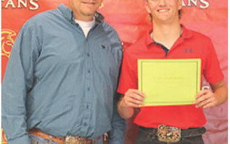 Senior, Cal Saporito, received three ag related scholarships from CUHS Ag Instructor, KC Youngblood during the Senior Assembly, May 15 at the Columbus High School Gym. The Raymond Mitchell Memorial, The Willy Benedict Memorial, and the FFA Alumni Scholarships were awarded as $500 per scholarship.