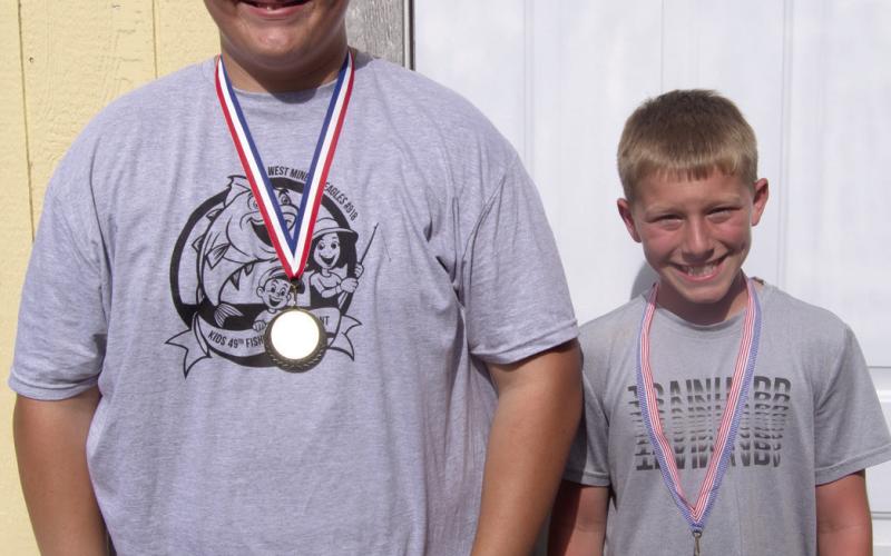 Above In the 11-15 Bass age group Hunter McVey was first and Tate Godfrey was second. Not pictured was third place finisher Kailynn McMi-In