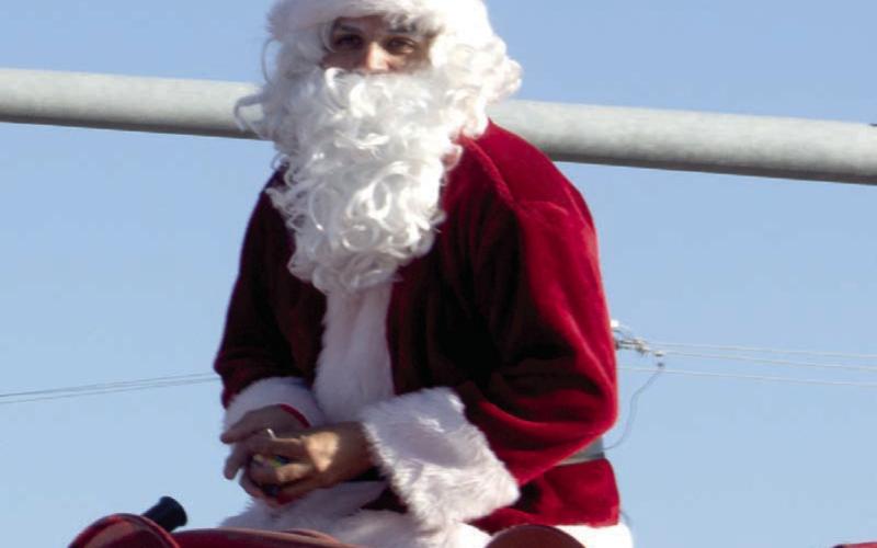 Santa once again was atop the Baxter Springs fire truck to close the Baxter Springs Christmas parade. The near perfect weather led to a large crowd and much candy for the youngsters.