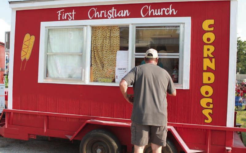 Among the food choices at the Cherokee County Fair is the popular (and famous) corn dog stand operated by First Christian Church.