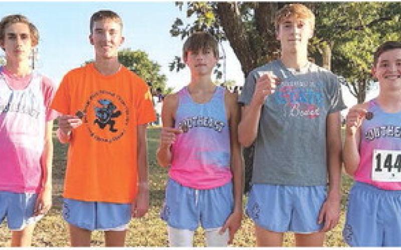 The Southeast Lancer Boys Cross Country took top honors at the Columbus Invitational Meet, Tuesday, at the Brush Creek Golf Course. Zack Whittenburg, Ryan Sossmanm, Henry Burns, Tucker Sutton, Zayne Gabern, Hudson Locke, and Michael Smith scored 52 team points, to beat Pittsburg, 57, for first. Courtesy photo.