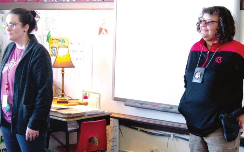 School Counselor Alison Wilkins (left) and School Resource Officer Anne Sharp (right) brief Highland Elementary third grade teacher Bekah Hutto’s class on the ALICE program last week. Students were briefed on what steps to take in the event of an armed intruder being on campus. Photo by Jacob Spencer.