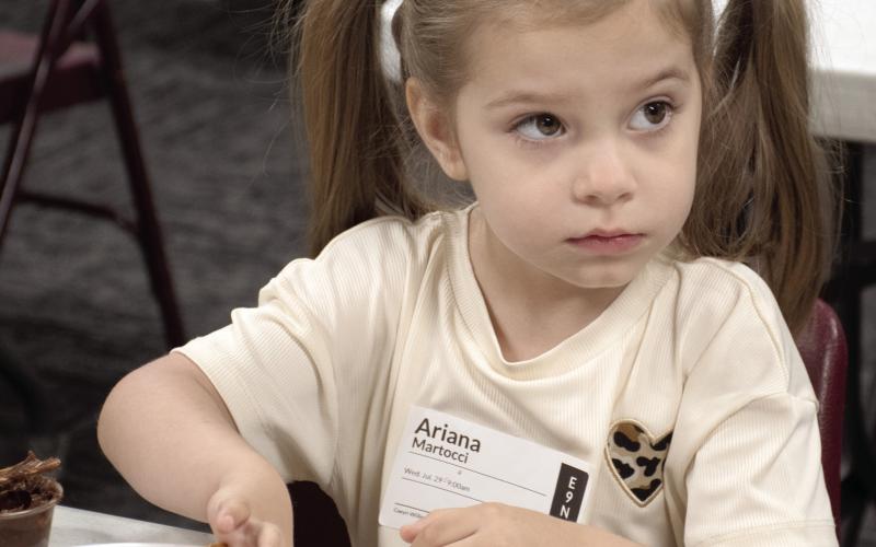 Connecting Point Church of the Nazarene recently held their first Vacation Bible School, ‘Rainforest Falls’. The theme focus for Wednesday, July 29 was “God is our safe place.” Ariana Martocci builds a cabin of graham crackers, pretzels and Nutella.