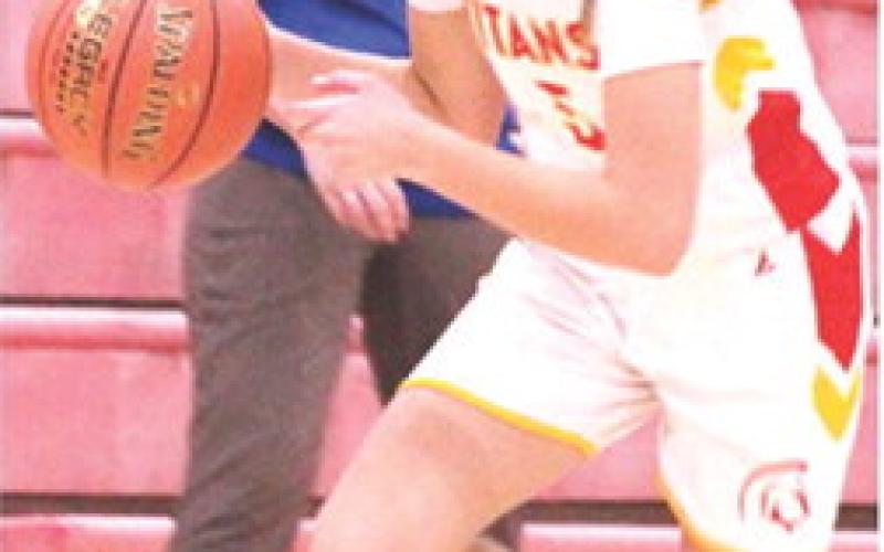 Lady Titan Eighth Grader, Kip Saporito, drives the court during a home game against St. Mary’s-Colgan, October 30. Columbus moves to the midway point of their season with games in Frontenac, today at 5:30 p.m. They will host Galena, Thursday, at 1 p.m.
