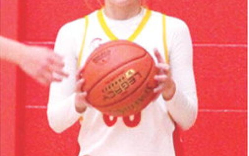 Piper Hill, Columbus Lady Titan Eighth Grader, looks to inbound the ball in a recent 8A game at the Central School Gymnasium.