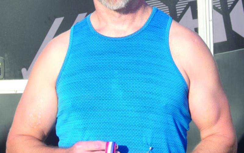 Male age 50 to 59 first Buddy Romine 22:10.