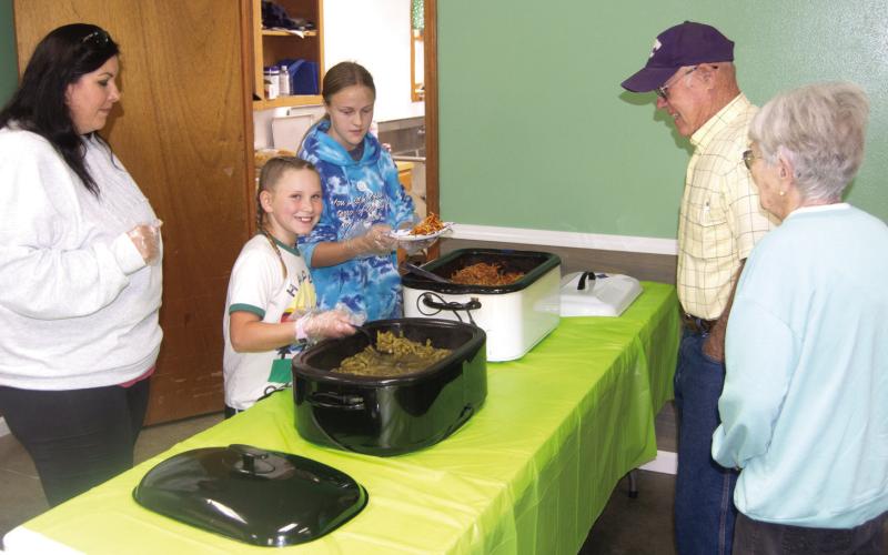 Members of the Cherokee County 4-H Clubs held a spaghetti lunch to raise funds for improvements to their local building. The youth helped prepare and serve the lunch to area diners. Keith and Helen Kelly were among the diners supporting area youth.
