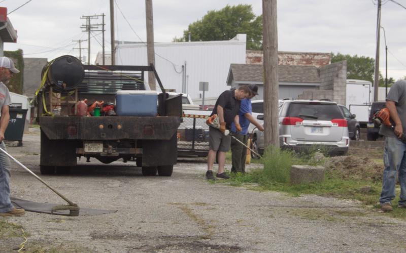 City employees were busy as part of the Imagine Columbus Service Day. The City joined in by cleaning and weeding alleys and parking lots in the city.