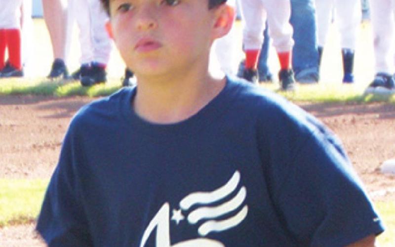 Major Leaguer, Trezden Breuil was top in candy sales for his division and received a $100 Academy gift card during the Baxter Springs Little League opening ceremonies. Photo by Dee Riley.