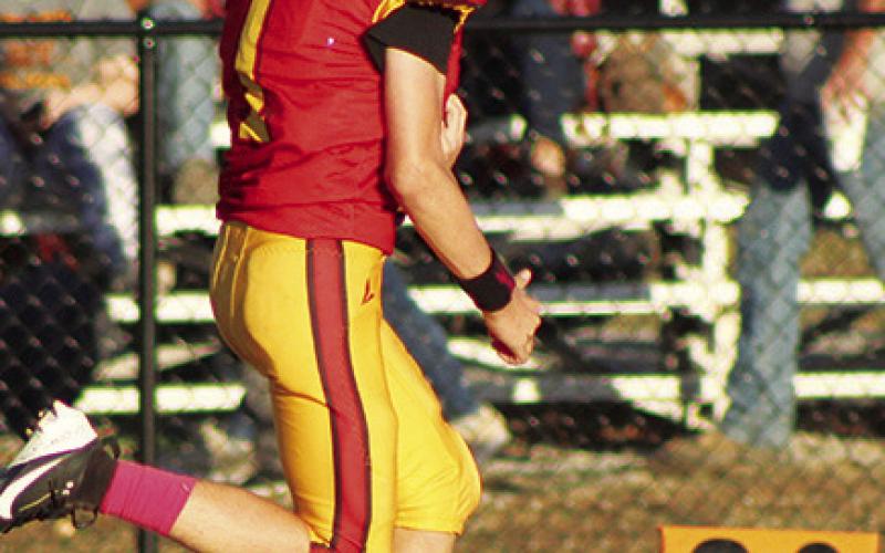 Denver Hughes, broke away down the east sideline for a 46-yard touchdown, the first six points in the Columbus Eighth Grade, 34-12, win over Girard, Tuesday at Titan Stadium in the teams final game of the season.