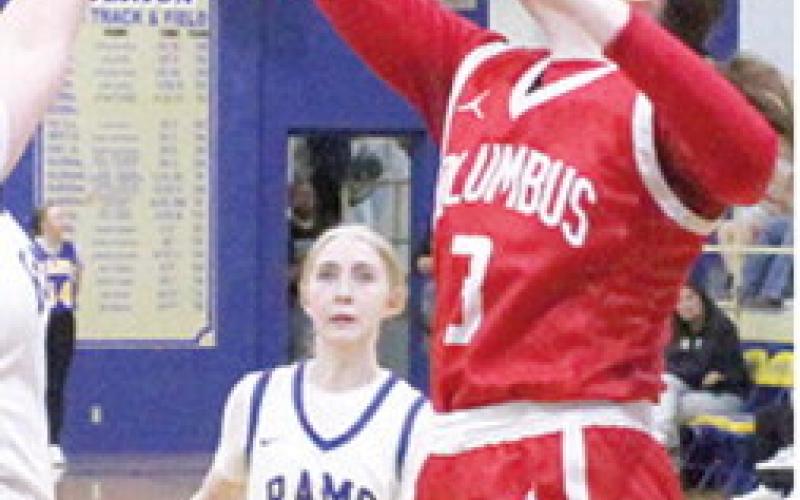 Lady Titan Senior, Katelyn Draeger, snagged a rebound late in the game from the Lady Rams the Columbus loss at Riverton, 20-49, December 19. Lady Ram Junior, Chloe Green, watches from the free throw line.