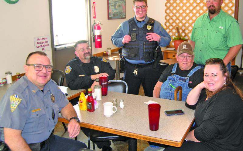 Cherokee County Sheriff Brian Henderson, Baxter Springs Police Chief Jimmy Hamilton, Assistant Baxter Springs Police Chief Corky Hicks and Community Outreach Deputy Rhanda Andrews visit with locals at a recent “Coffee With a Cop” event.