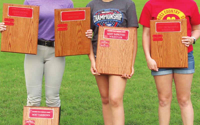 Addison Saporito, Lady Titan Sophomore, collected team awards for most takedowns (39), most pins (24) and Outstanding Wrestler at the Annual Titan Booster Club Awards Ceremony, May 5 at Titan Stadium. Freshman, Brooklyn Lima was named Most Improved and senior, Dixee Lacen was chosen Most Inspirational.