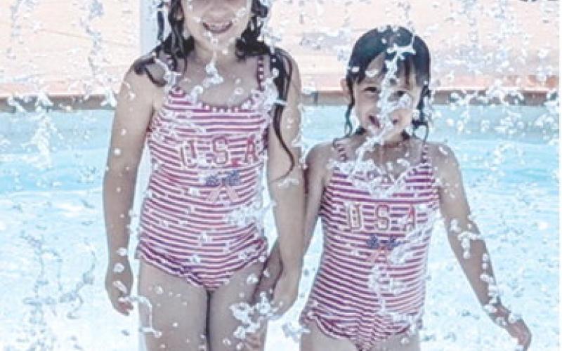 With school starting, the pool is now closed for the season. Throughout the summer numerous youngsters took advantage of the cool break. Wearing matching USA swimsuits, Kinsleigh Lyman and Brynleigh Lyman attended the Columbus Free Swim sponsored by the city.