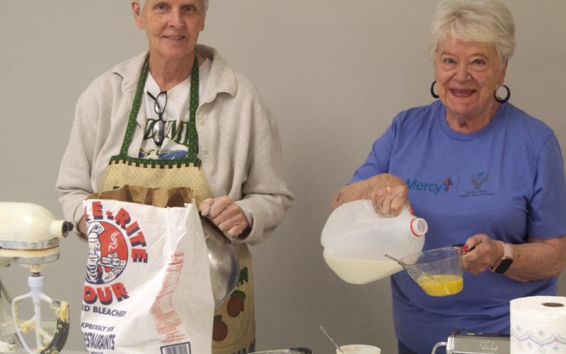 Mercy Auxiliary members Debra Messer and Nancy Evans were mixing the egg noodle dough. The Auxiliary was having a fundraiser selling homemade noodles.