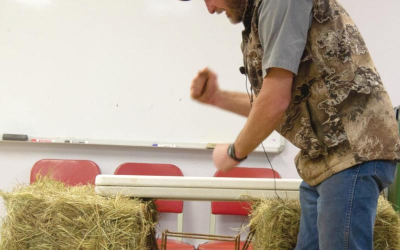 KSU Wildlife Specialist Drew Ricketts was at the Cherokee County Research and Extension Office in Columbus for a beaver trapping workshop March 4. Attendees are shown how Ricketts sets his own traps in the openings of beaver dens. Photo by Jacob Spencer.
