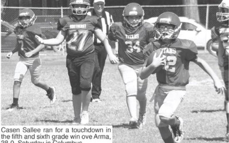 Casen Sallee ran for a touchdown in the fifth and sixth grade win ove Arma, 38-0, Saturday in Columbus.