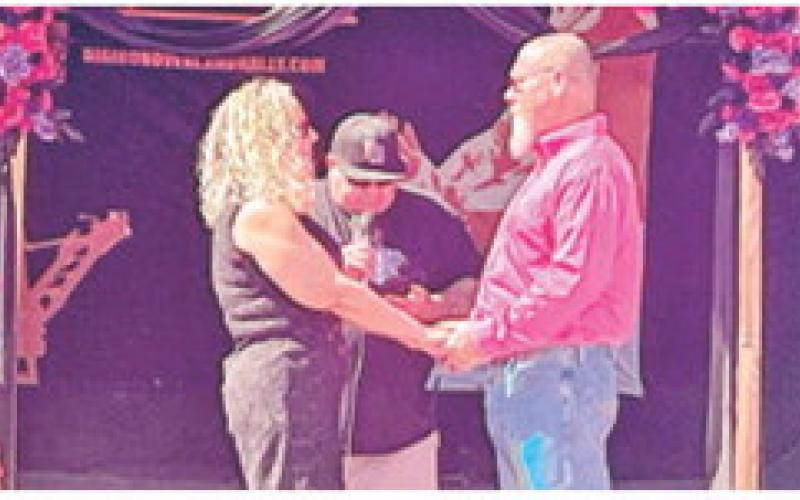A Conway, Arkansas couple renewed their wedding vows in the shovel of Big Brutus during the recent Big Iron Overland Rally. Chris and Amy Marlar exchanged vows with son Bryer Marlar and daughter Bethany Marlar attending the wedding in addition to the Big Iron crowd and Ryan “Rhino” Lieberman of the Big Iron staff performed the ceremony. Courtesy photo.