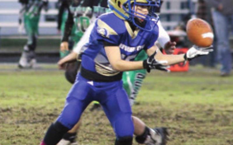 Corbin Thompson with the catch for a first down. Third and fourth grade Riverton Rams coasted over the Quapaw Wildcats Saturday night scoring 41 points. The Rams going into playoff with a 6-0 record. Courtesy photo.