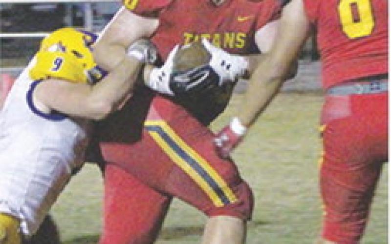 Carter Henry, Titan Senior, drug Viking Junior, Sean O’Banion, across the goal line to score the second touchdown for Columbus in their Kansas Class 3A State Playoff victory over Parsons, 21-0, Friday at Titan Stadium. Senior, Rece Ponce, met Carter in the end zone after the four-yard. Rece scored the final touchdown in the third quarter on a pass from senior, Jack Vilela.