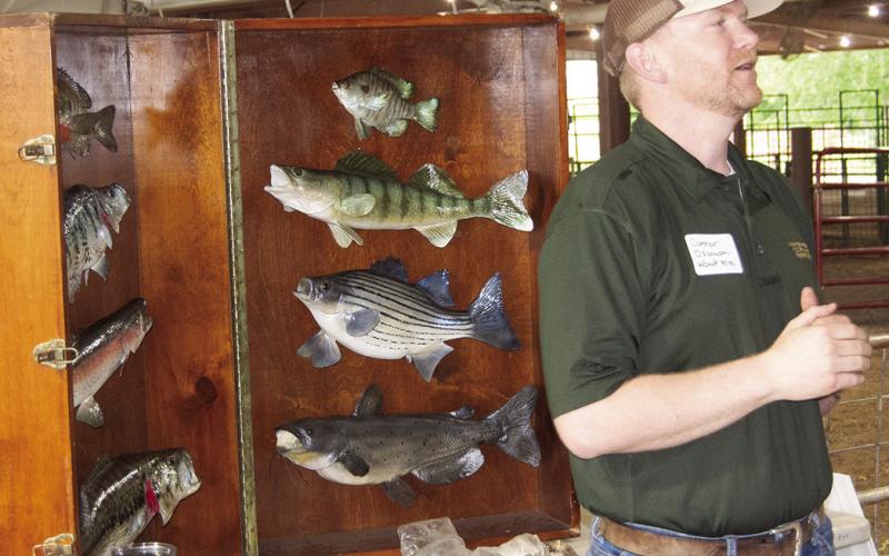 Kansas Department of Wildlife and Parks representative, Connor Ossowski presented the different fish found throughout Kansas at a recent Earth Day event for fourth and fifth graders. News Report photo by Tanya Woolsey.