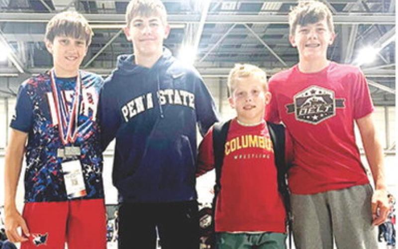 Titan Wrestlers Briggs Johnson, Blaze Bowman, Baylor Bowman, and Cam Carter were part of the Titan Team that participated in the Kansas State Freestyle/ Greco Wrestling in Topeka early in May. They all finished in the top five at the best-of-the-best tournament. Courtesy photo.