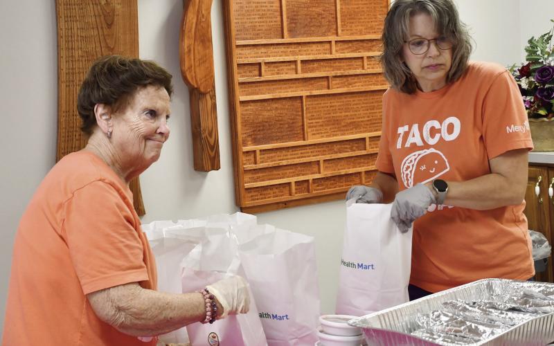 Ann Thiele and Melissa Torchia were packing orders for the Mercy Auxiliary Taco fundraiser. Funds will be used toward an inhouse 3D mammography machine. Photos on this page by Tanya Woolsey.