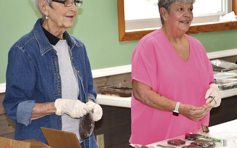 A pulled pork fundraiser was held for Jon Heistand. Community support is a valuable asset and volunteers are appreciated for their efforts. Geneva Grubbs and Marla Tanner were working the dessert table.